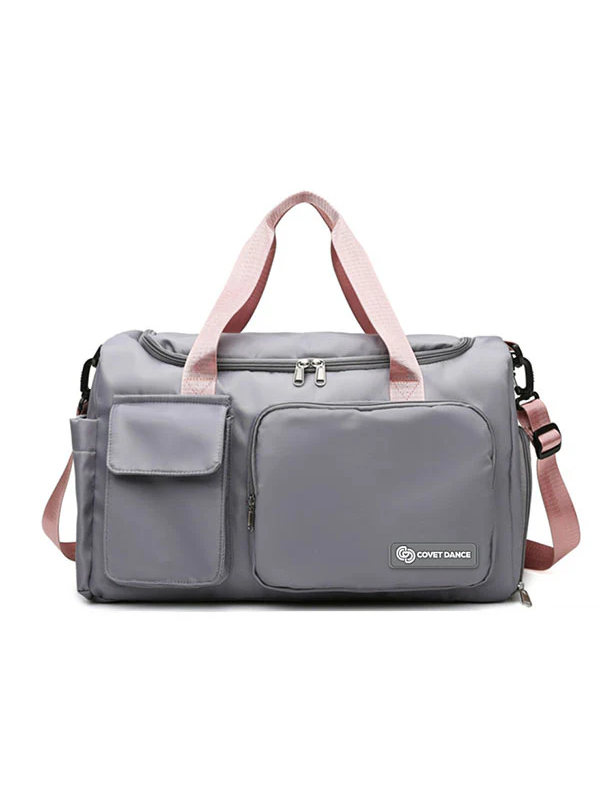 
                      
                        A grey duffel bag with pink straps against a white background.
                      
                    